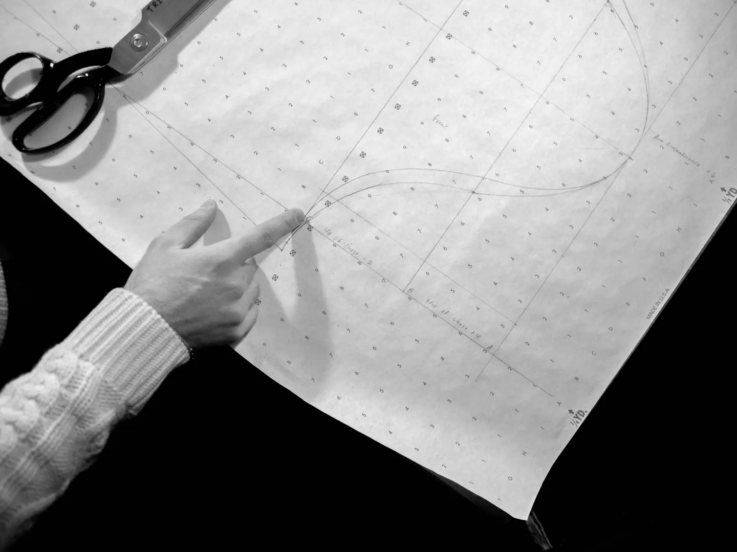 A pattern marked out in pencil on spot-and-cross paper.